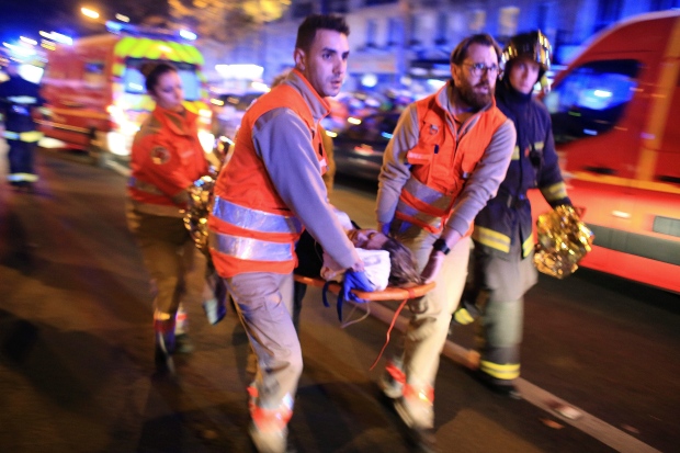 wounded woman evacuated from Bataclan concert hall, Paris