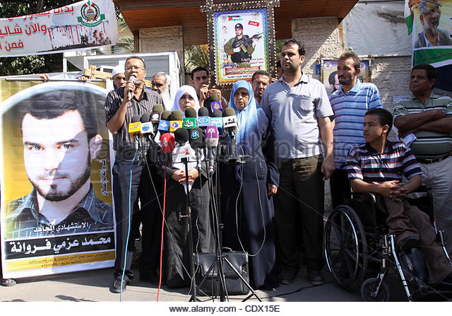 The family of Mohammed Azmi Ferwana deliver a speech during a press conference to demand the release of their son's body by Israel