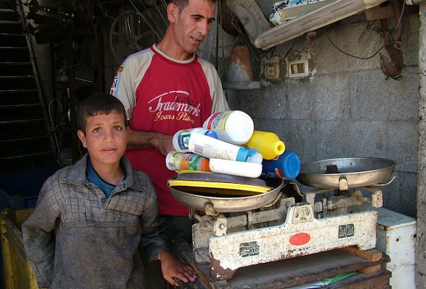 father and son in Gaza, selling wares on the street to make money
