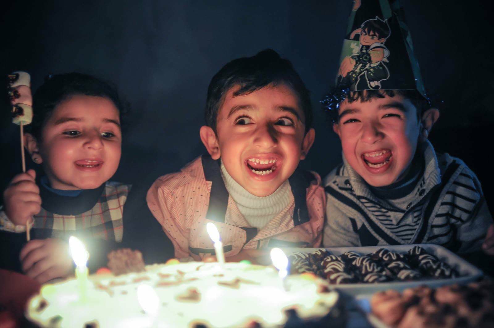 My nephew and two friends celebrate his birthday with no electricity