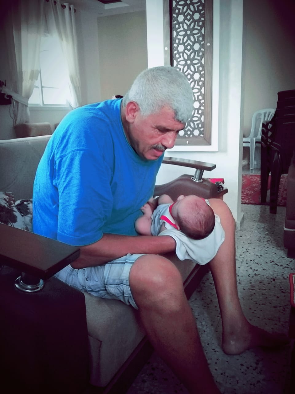grandfather and newborn