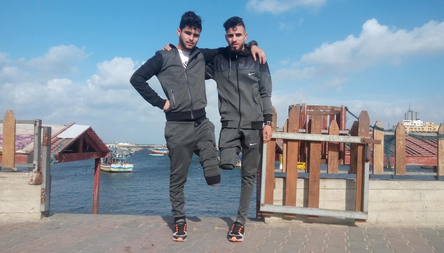 Two young men with amputated feet