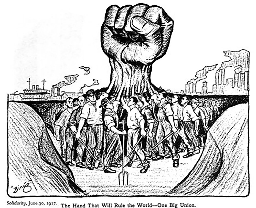 An upraised fist surrounded by men holding it up