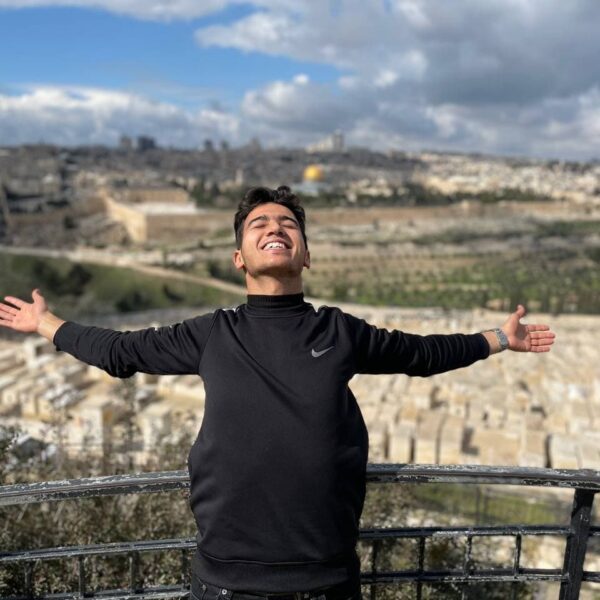 Man standing in front of Jerusalem