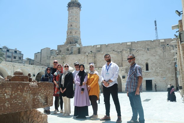 please standing on grounds of ancient building in Gaza