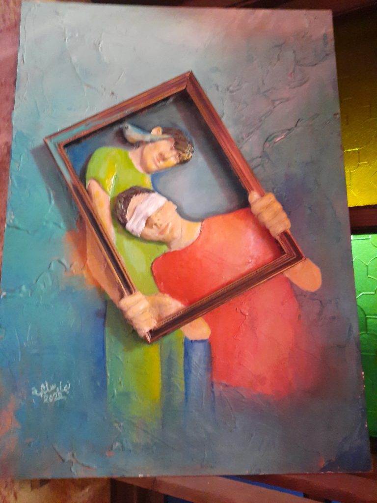 painting of bilndfolded couple inside picture frame