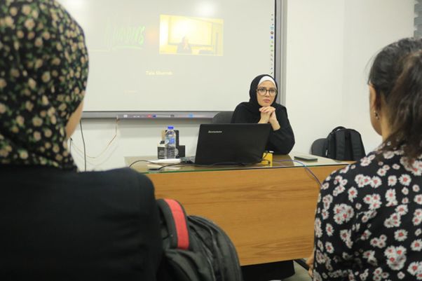 Zarifah Baroud teaching class