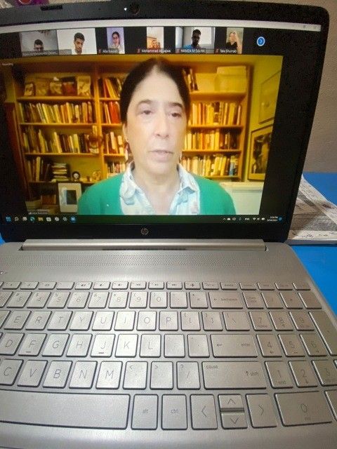 Laptop with screenshot of Alice Rothchild.