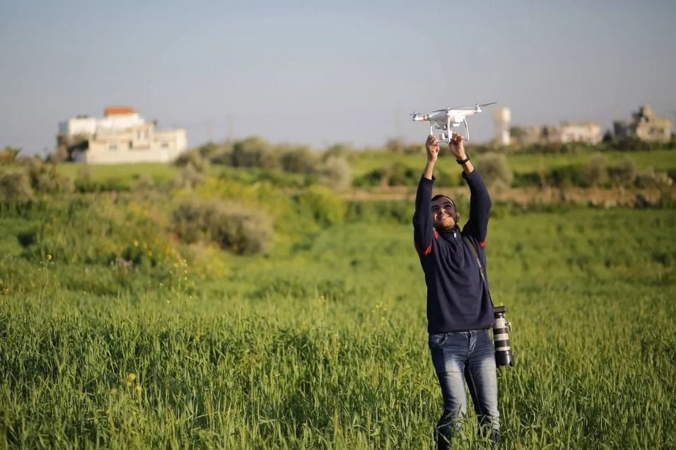 Journalist Yaser Murtaja flying a drone.
