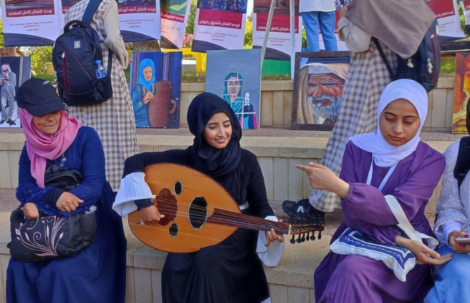 Suhair al-Shawi while performing Palestinian music. 