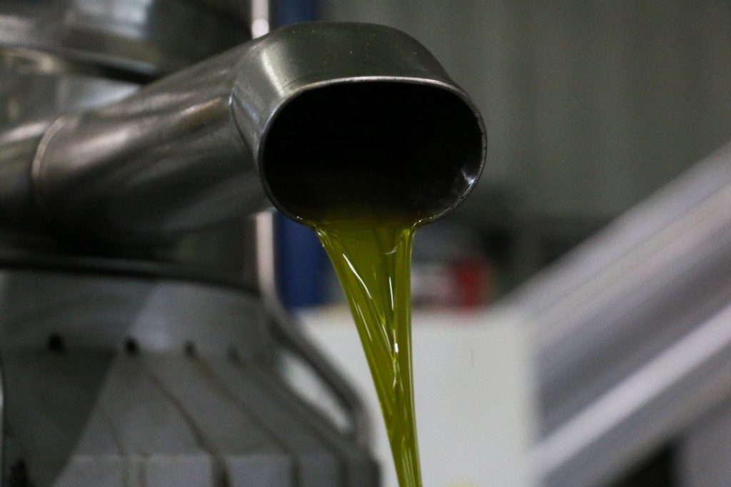 olive oil coming out of spout.