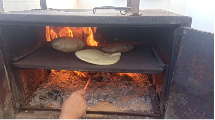 Bread being baked in an oven.