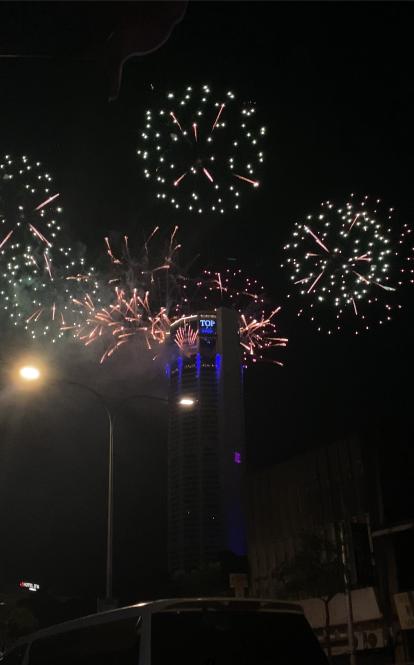 Fireworks behind office highrise in Malasia.