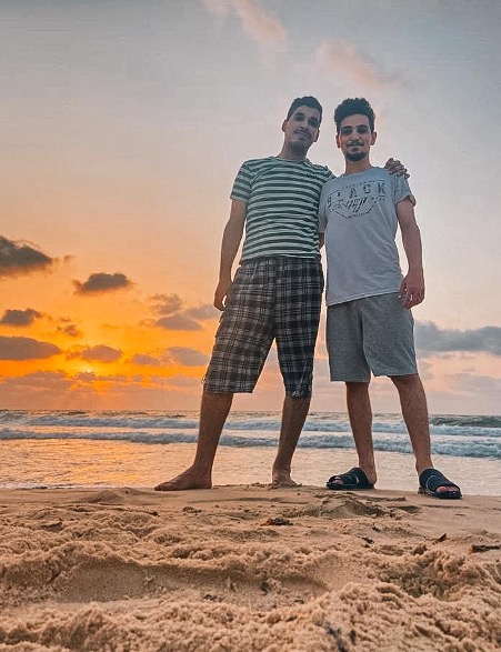 Two young men on Gaza beach.