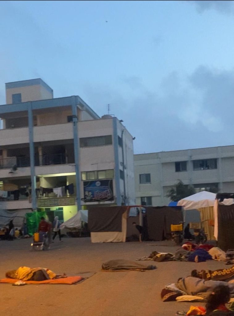 People sleeping in the courtyard of the UNWRA school.