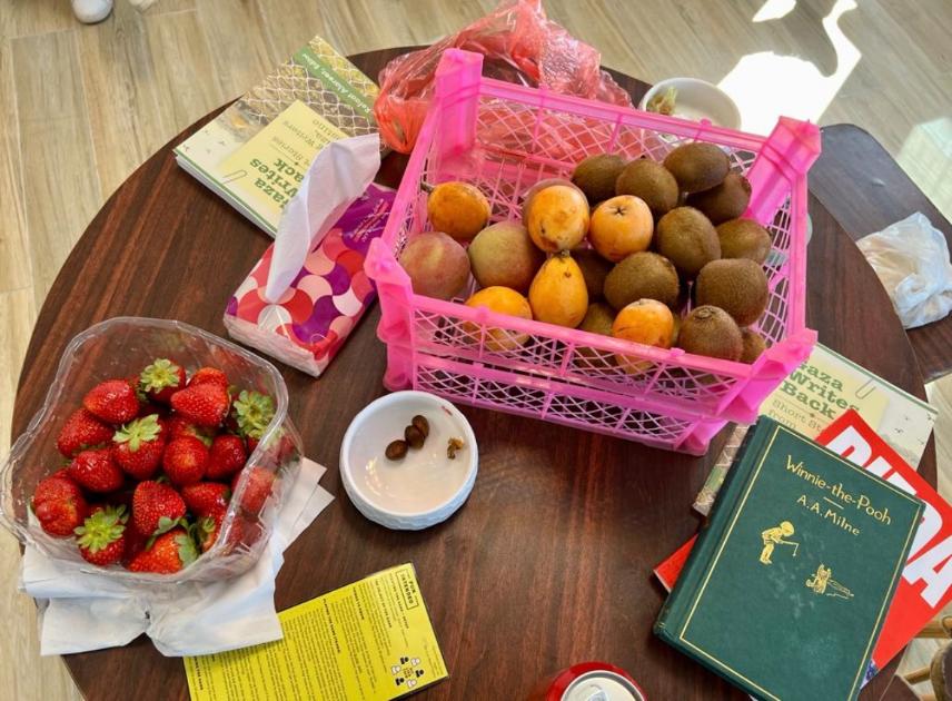 Figs, fruit, and other treats on a classroom table.