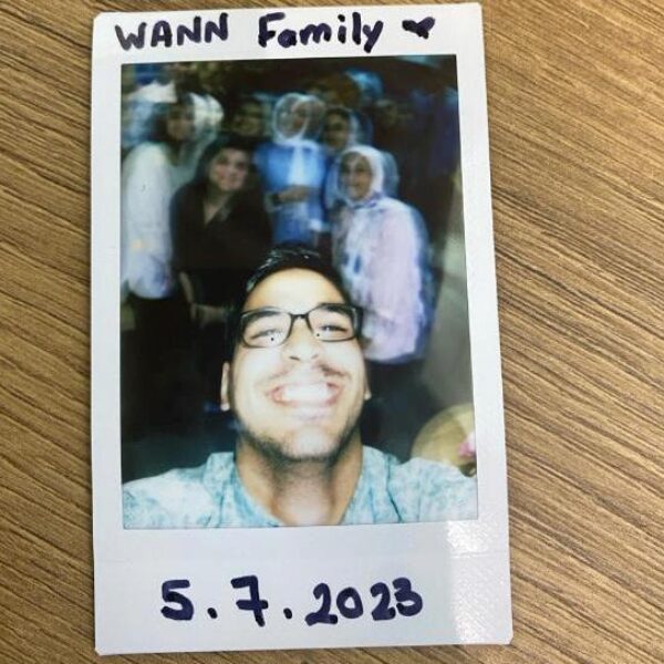 Polaroid of young people. Text: WANN Family 5/7/2023