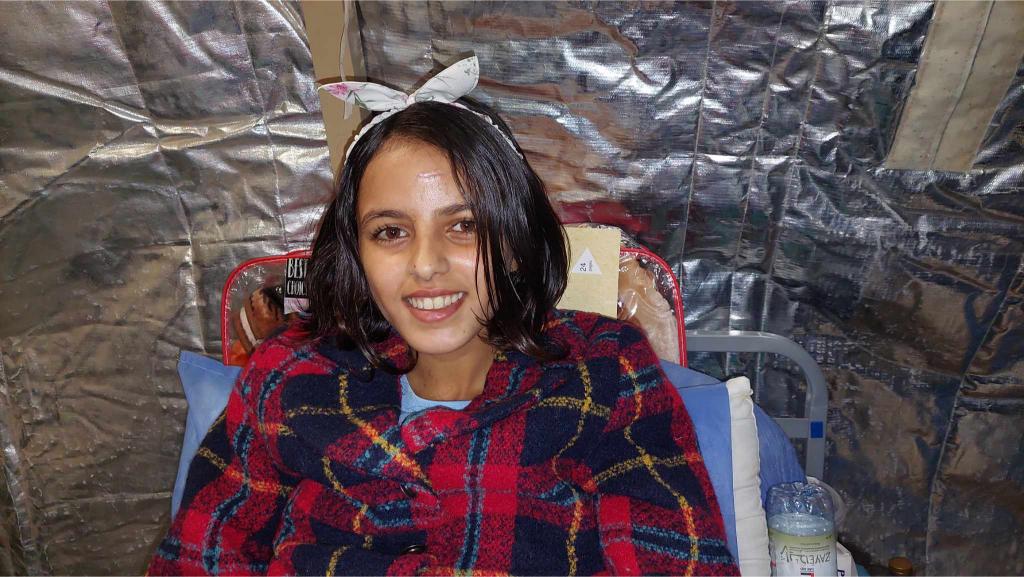 12-year-old girl in hospital bed.