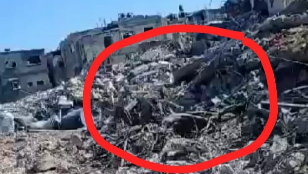 Rubble, with a red circle indicated where a home had been.