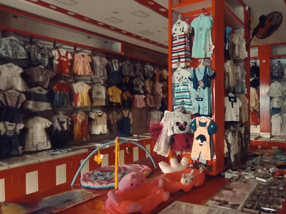 A story display of children's clothing.