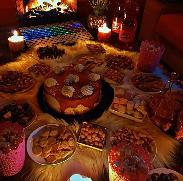 Cake and other treats spread on a table for a birthday celebration.