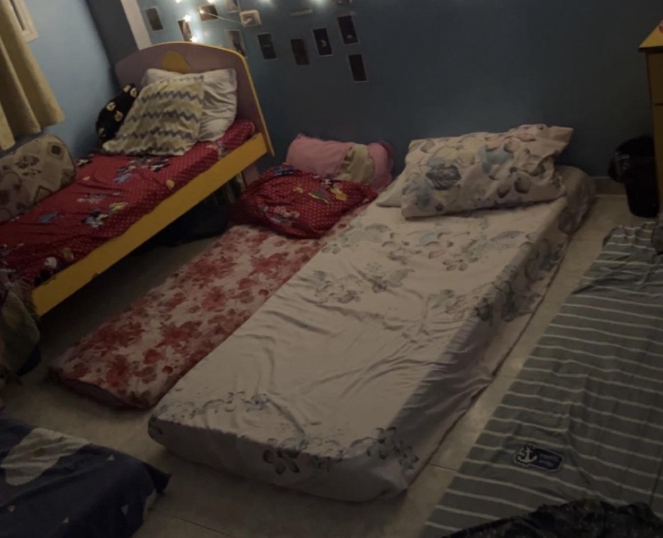 mattresses side by side on the floor.