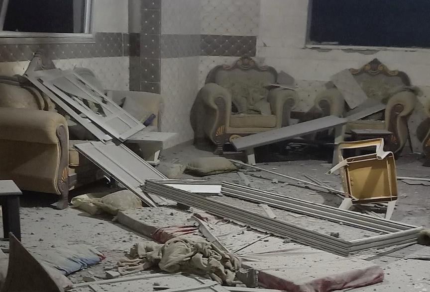 A living room destroyed by an airstrike.