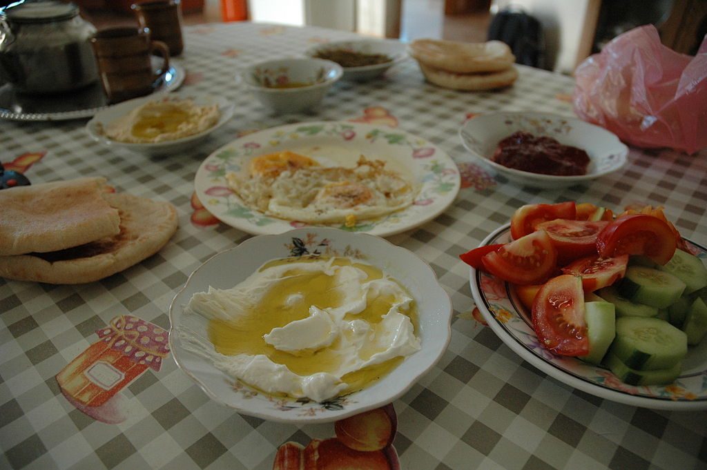 Palestinian breakfast of egg, tomatoes, cucumber, doha and olive oil, etc.