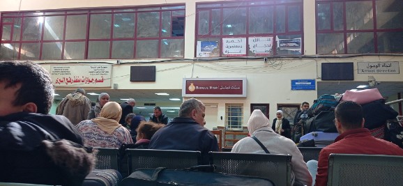 People sitting in waiting area of Egyptian side of the Rafah crossing.